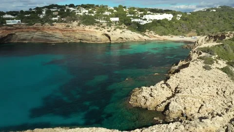 Drone flying towards Cala Codolar beach, in Sant Josep de sa Talaia, Ibiza. Stock Footage 169042298