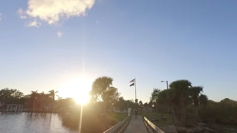 Drone flying towards camera with US flag in background Video stock 98946258