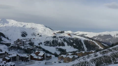 Drone flying towards a closed ski resort with a beautiful morning light coro Stock Footage 145711181