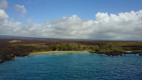 Drone flying towards desolate beach in hawaii Stock Footage 102014580