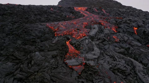 Drone flying towards flowing lava in Iceland Aerial Video stock 155486437