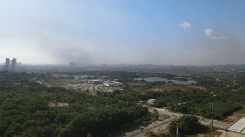 Drone flying towards forest and mosque in Cyberjaya Stock Footage 149383479
