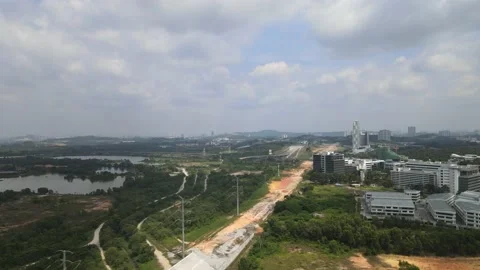 Drone flying towards highway which is under construction in Cyberjaya Stock Footage 149380505