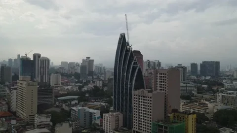 Drone flying towards iconic building in Kampung Baru Stock Footage 150290941