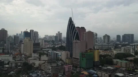 Drone flying towards iconic tower in Kampung Baru, Kuala Lumpur Stock Footage 150289525