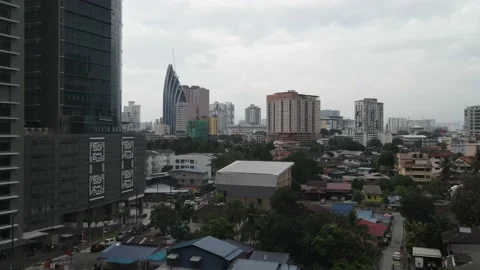 Drone flying towards iconic tower in Kampung Baru, Kuala Lumpur Stock Footage 150289616