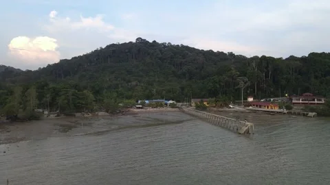 Drone flying towards jetty and beach in Teluk Kemang Stock Footage 150722155