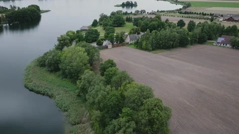 Drone Flying Towards Ostrow Lednicki Island on Lake Lednica, Poland Video stock 324976360