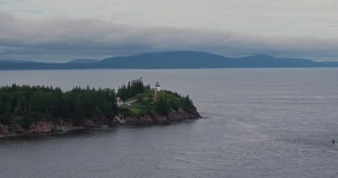 Drone flying towards owl's head lighthouse at us east coast 스톡 동영상 247472515