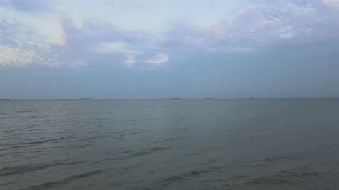 Drone flying towards the sea passing through tree Stock Footage 149630402