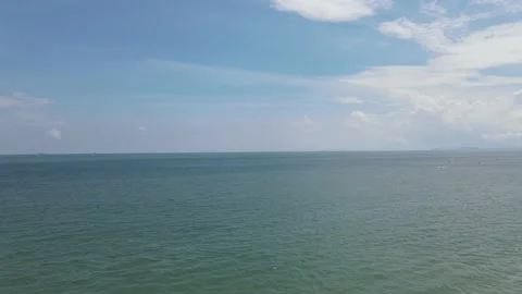 Drone flying towards sea with view of clear sky in Penang Stock Footage 150075824