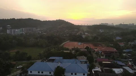 Drone flying towards sunset in Desa Pinggiran Putra Stock Footage 150748102