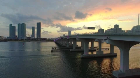 Drone Flying Towards Sunset in Miami Low to High in 4K Stock Footage 63745373