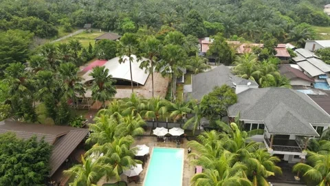 Drone flying towards swimming pool in Penang Stock Footage 149870124