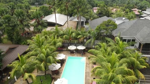 Drone flying towards swimming pool in Penang Stock Footage 149870136