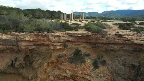 Drone flying towards the Time and Space monument, in Cala Llentia, Ibiza. Stock Footage 169042660