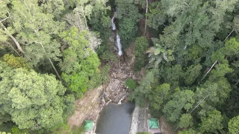 Drone flying towards Waterfall and Pool in Jeram Toi Stock Footage 149717835