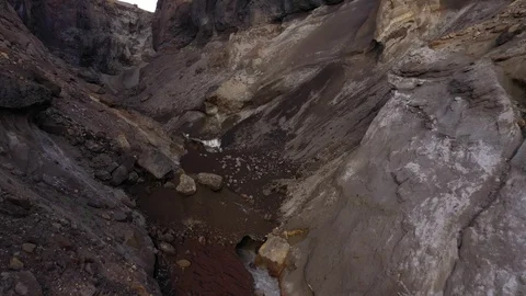 Drone Flying Trough A Deep Gorge. Canyon With Waterfall. Kamchatka Peninsula.   Stock Footage 128664872