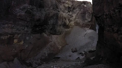 Drone Flying Trough A Deep Gorge. Canyon With Waterfall. Kamchatka Peninsula.   Stock Footage 128665157