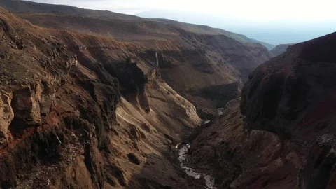 Drone Flying Trough A Deep Gorge. Canyon With Waterfall. Kamchatka Peninsula.   Stock Footage 128668082