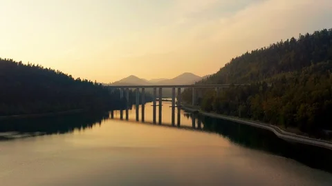 Drone flying under the bridge at Bajer lake in Fuzine, Croatia. Stock Footage 115078772