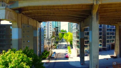 Drone flying under Bridge reviling Amazing DownTown High Rise and Beach  Stock Footage 132548331