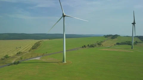 Drone Flying Upward Between Wind Turbine Blades Stock Footage 314940401