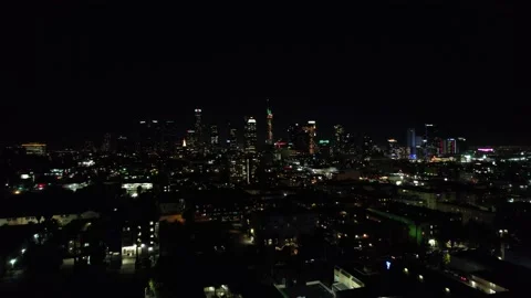 Drone Flying Upwards Looking at Downtown Los Angeles at Night Stock Footage 228081374