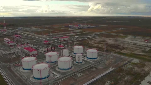 A drone is flying. Video the sky is covered with clouds, cloudy. An oil and gas Stock Footage 150242782