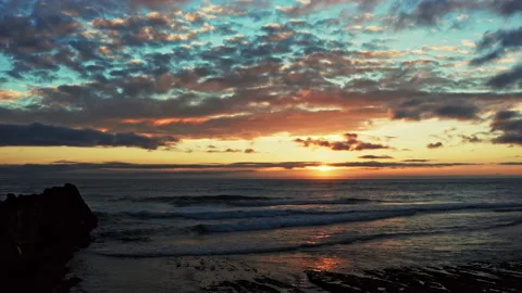 Drone is flying to the water surface of the ocean during sunset. Stock Footage 199676011