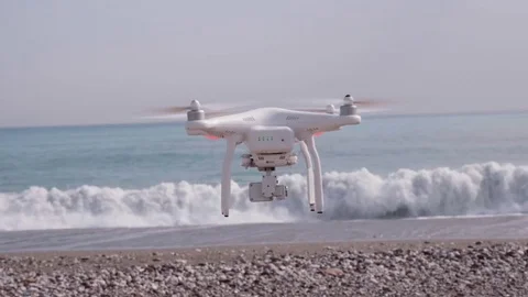 Drone flying to wavy sea 動画素材 72400071