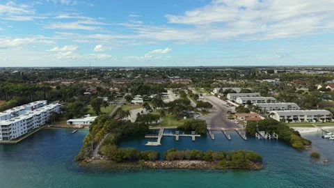Drone flying west over ICW toward Harvey Oyer Park showing marina facilities Stock Footage 335411533