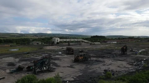 Drone flyover of abandoned coal handling facility in Ayrshire Stock Footage 337930934
