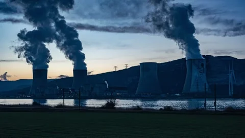 Drone flyover above Cruas nuclear plant by Rhone River in France aerial view Video stock 331398596