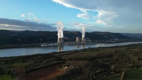 Drone flyover above Cruas nuclear plant by Rhone River in France aerial view Stock Footage 333772001
