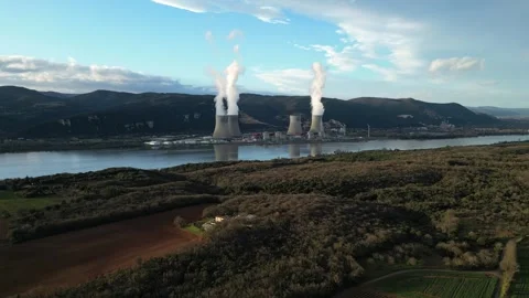 Drone flyover above Cruas nuclear plant by Rhone River in France aerial view Video stock 333772025