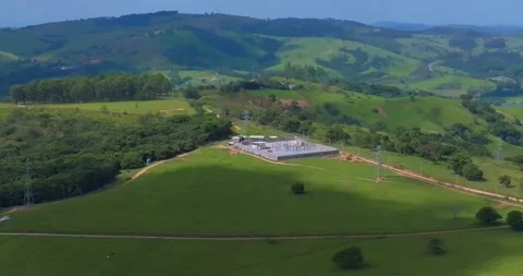 Drone flyover above electrical substation and pastureland in Minas Gerais Brazil Видео 335137774