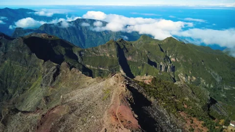 Drone flyover and tilt down over Pico Ruivo summit and hikers, Madeira Stock Footage 328640649