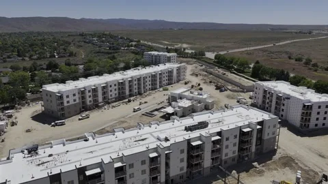 Drone flyover of apartments under construction Stock Footage 277140771