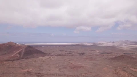 Drone Flyover of Arid Volcanic Terrain Near Calderon Hondo, Fuerteventura Stock Footage 309027748