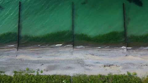 Drone Flyover from Baltic Beach to Open Sea with Turquoise Water Stock Footage 341887695