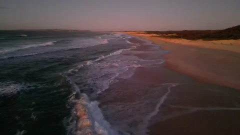 Drone flyover beach at dawn Stock Footage 209871606