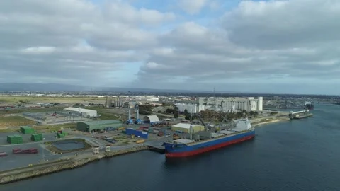 Drone Flyover of Cargo Ship Docked in Port Adelaide River Stock Footage 331277140