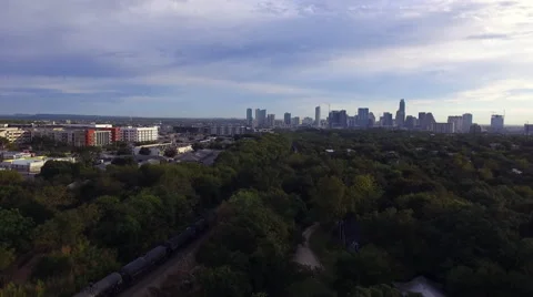 Drone Flyover Chasing Train into Downtown Austin after Sunrise Stock Footage 68079004