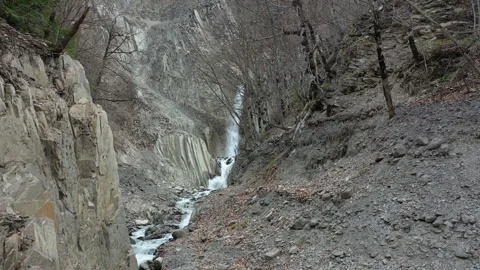 Drone Flyover of Crystal Clear Waterfall in Highland Landscape Video stock 303589780