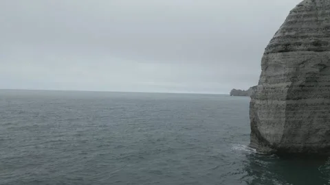Drone flyover of the famous Porte d&amp;#039;Aval arch, Etretat, France Video stock 337874492