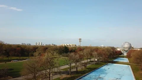 Drone flyover Flushing Meadow Park with Unisphere and Pavillion Stock Footage 106717466