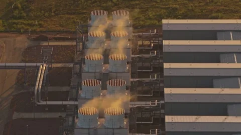 Drone flyover of Google data campus glowing at golden hour Stock Footage 318620294