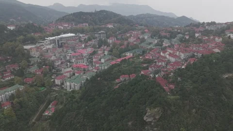 Drone Flyover of Guling Town Ridge with Hotel and Cliffs, Lushan Stock-Footage 346700003