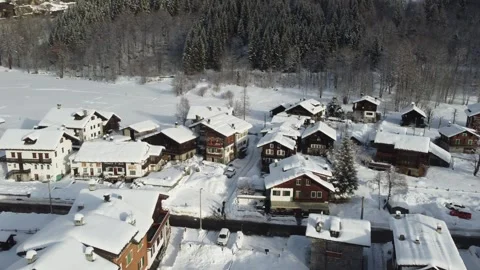 Drone Flyover of Icy Alpine Mountains Under Winter Sunlight Stockbeeldmateriaal 321864892